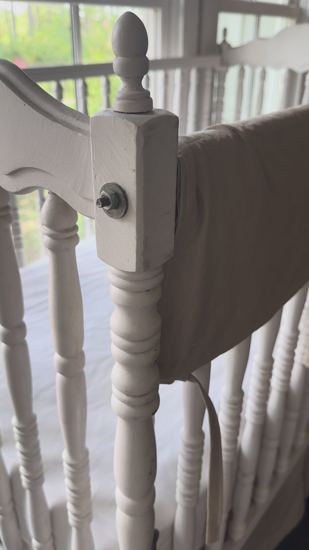 Video of oatmeal crib rail cover on a white spindle crib in a farmhouse nursery - High Cotton Textile