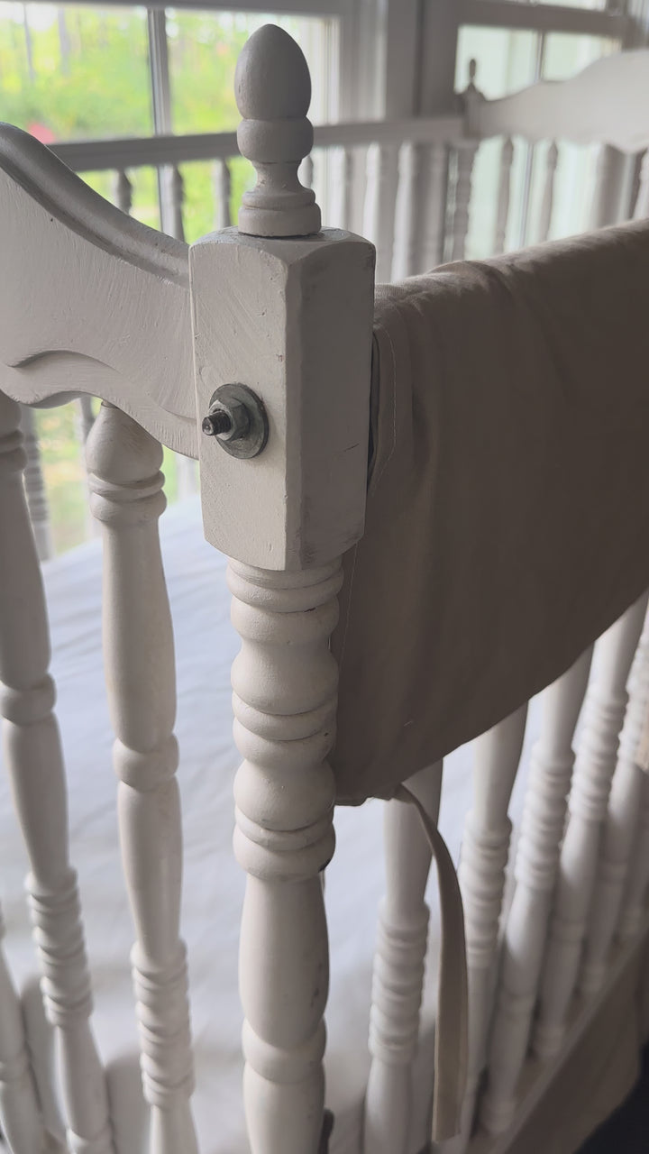 Video of oatmeal crib rail cover on a white spindle crib in a farmhouse nursery - High Cotton Textile