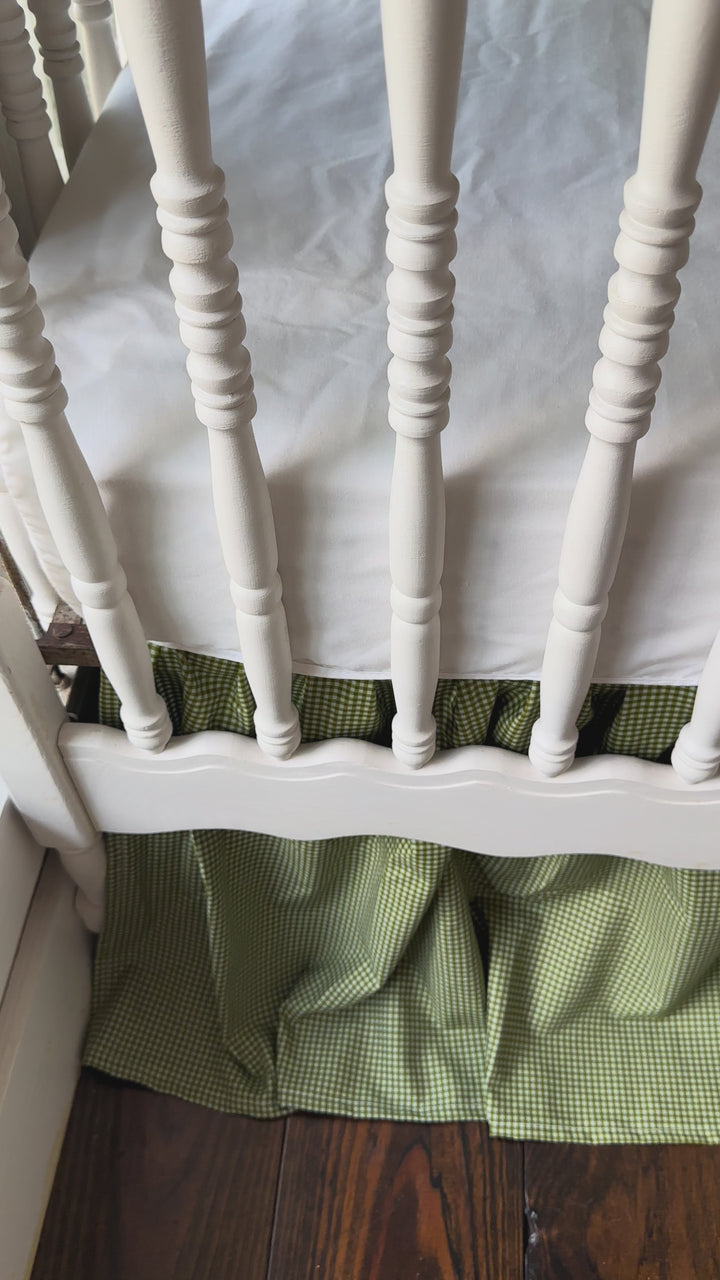 Video of the pine green gingham crib rail cover and farmhouse crib skirt on a white crib