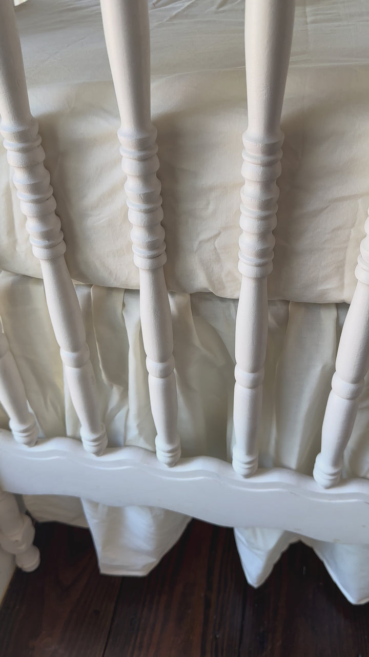Walking video of the Ivory Ruffled Crib Rail Cover & Farmhouse Skirt Set in the nursery