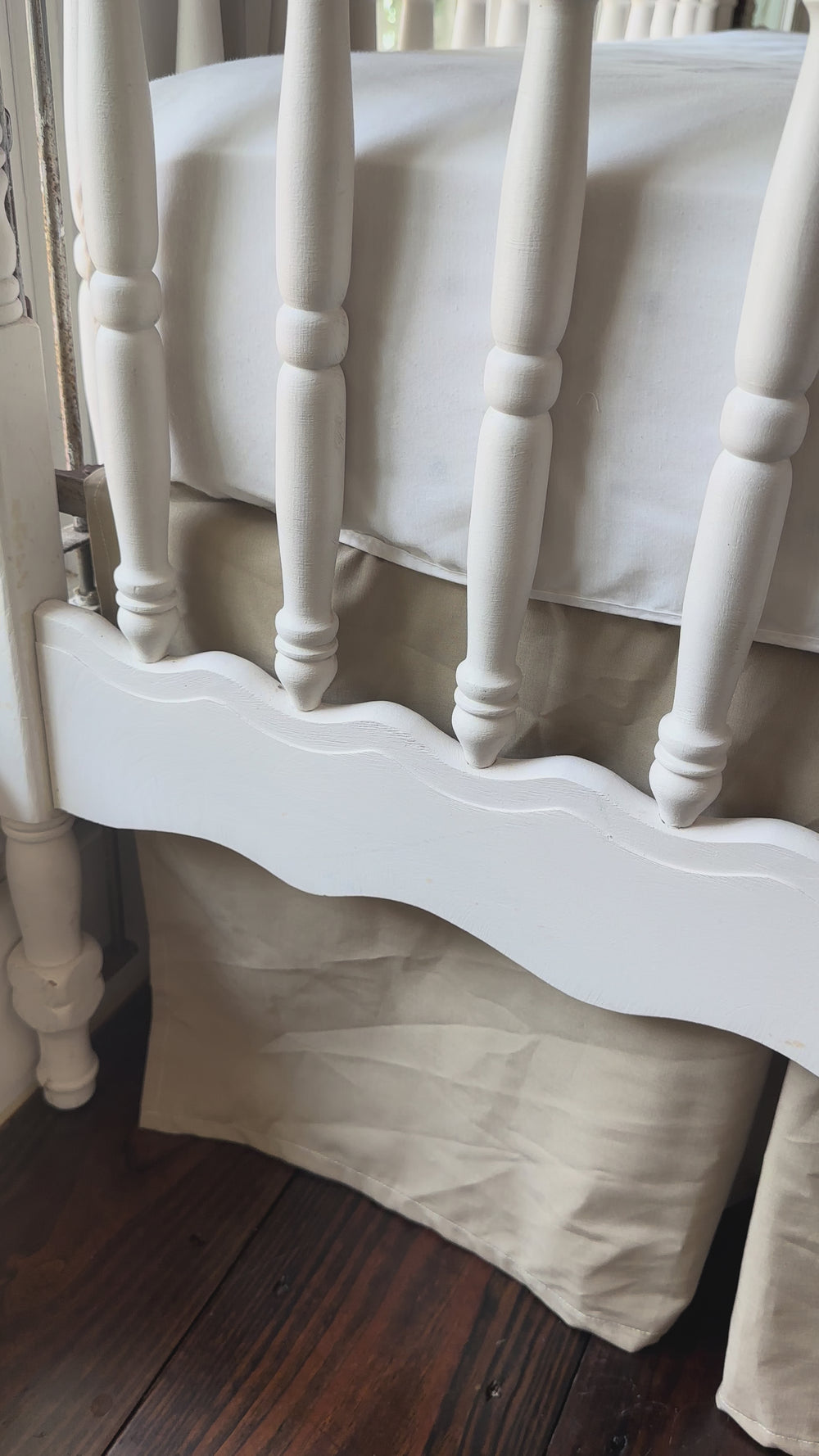 Video of oatmeal crib rail cover and crib skirt set styled in a farmhouse nursery - High Cotton Textile