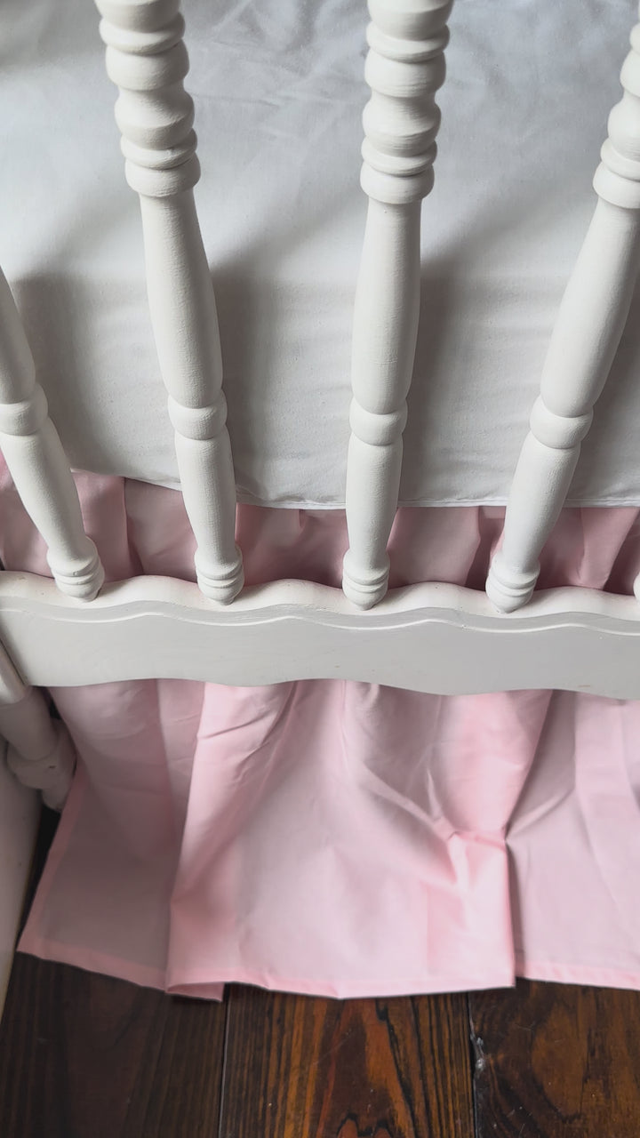 Video of the Sisters Pink scalloped crib rail cover, farmhouse crib skirt and large crib bows set