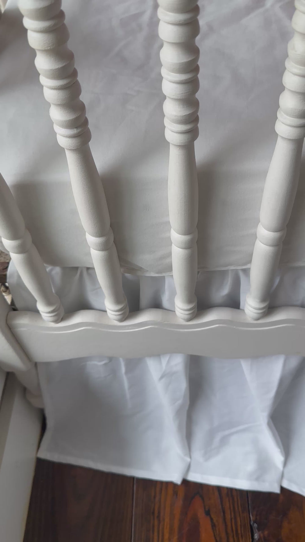 Walking video of the red ruffled crib rail cover and white farmhouse crib skirt in the nursery