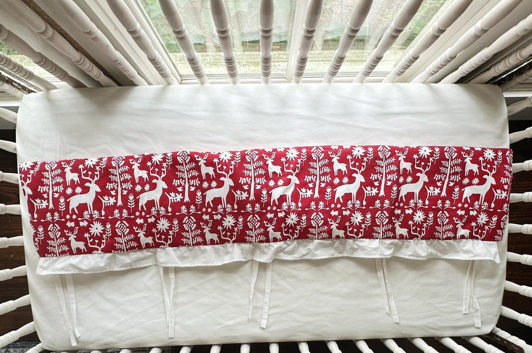 Overhead view of the red deer rail cover folded to show its length and white lining