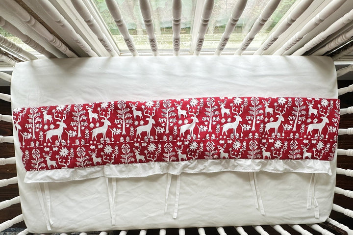 Overhead view of the red deer rail cover folded to show its length and white lining