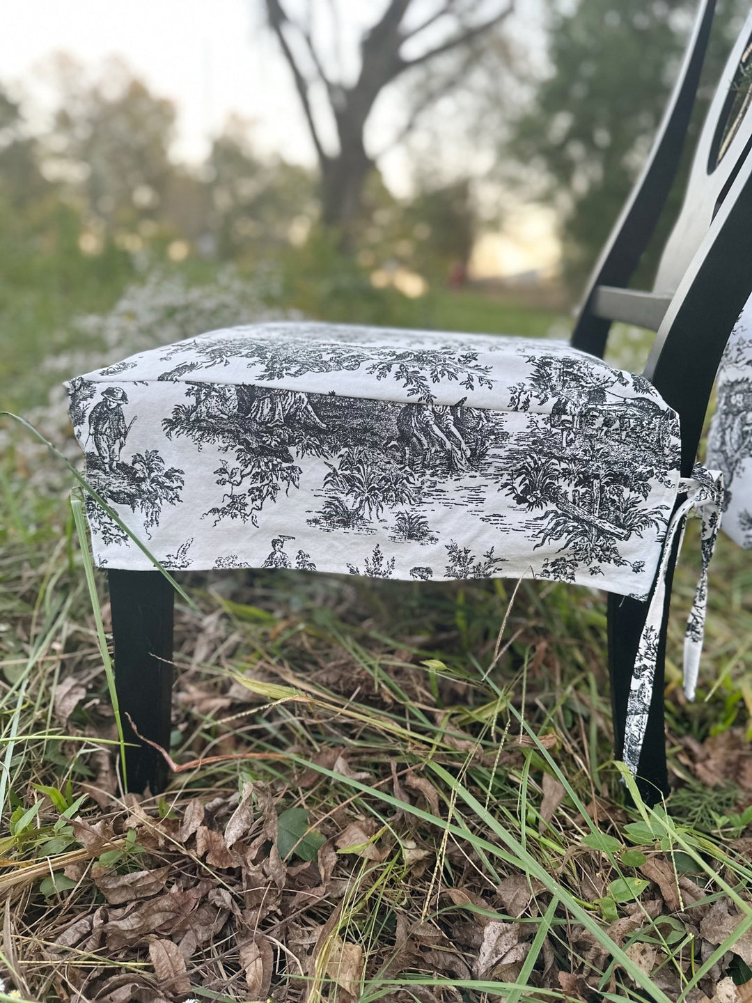 Corner detail of the toile seat slipcover, showing the clean fitted corner and hem