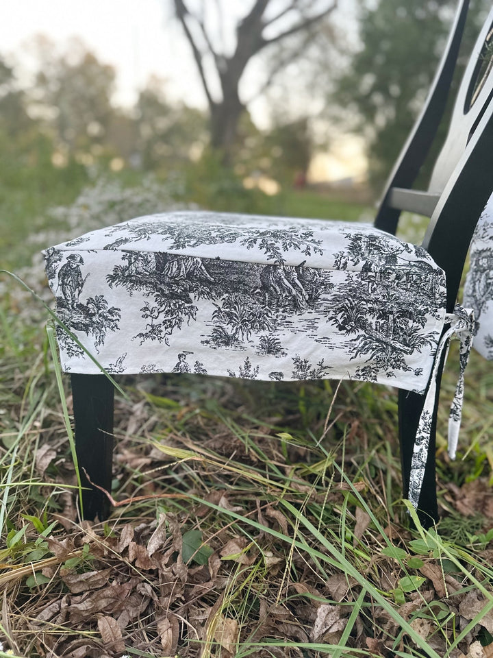 Corner detail of the toile seat slipcover, showing the clean fitted corner and hem