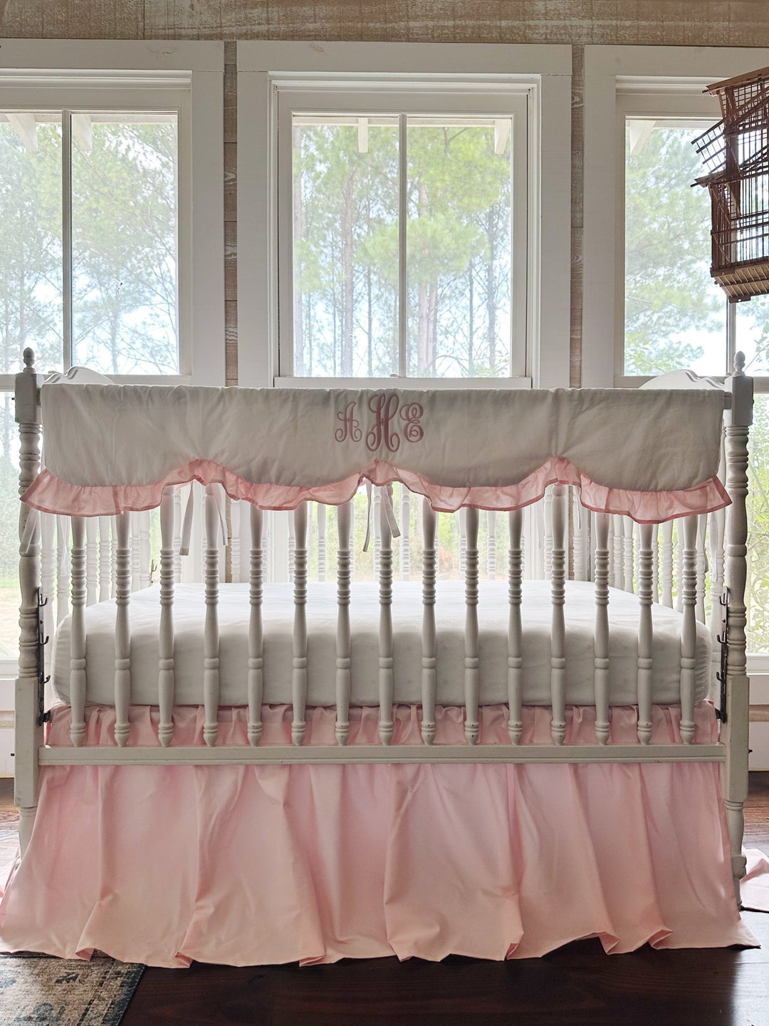 Sisters Pink two-piece crib bedding set with a monogrammed scalloped crib rail cover and gathered farmhouse crib skirt