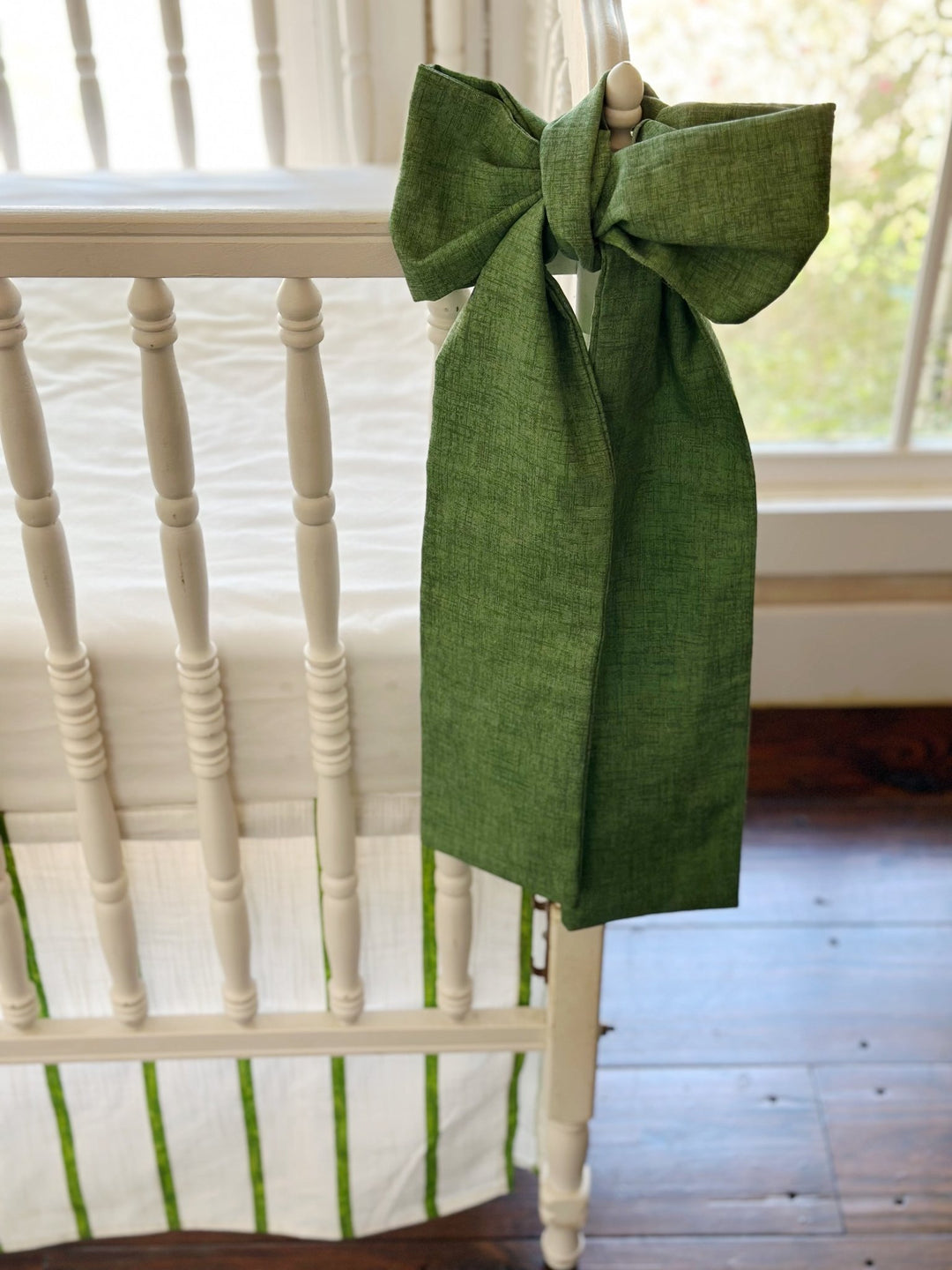 Close view of the solid cypress green sash and the texture of the washed cotton