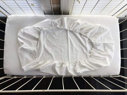 White fitted crib sheet in washed cotton, 28 by 52 inches