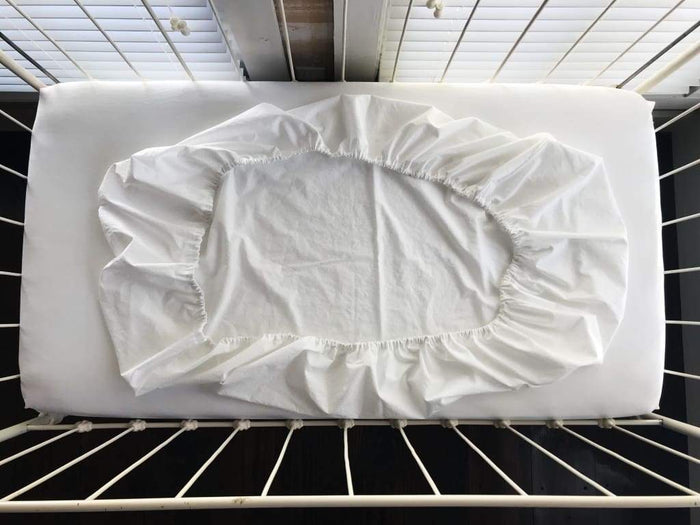 White fitted crib sheet in washed cotton, 28 by 52 inches