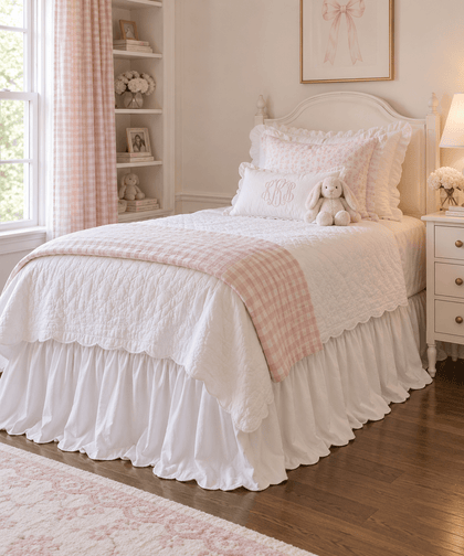 White ruffled twin bed skirt beside a white nightstand in a pink and white girl's room - High Cotton Textile