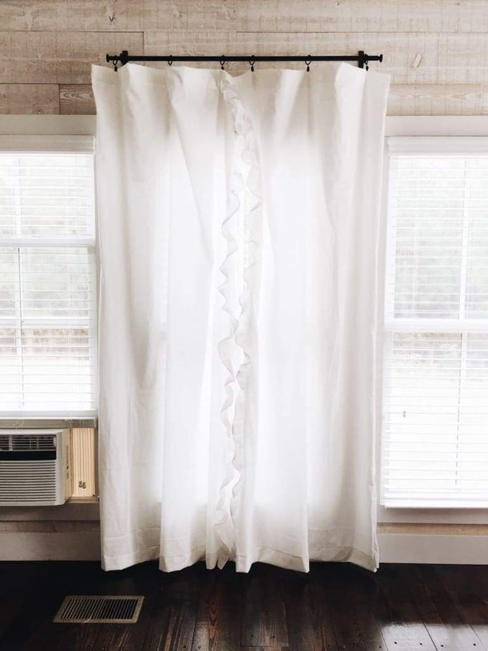 White ruffled nursery curtains in washed cotton