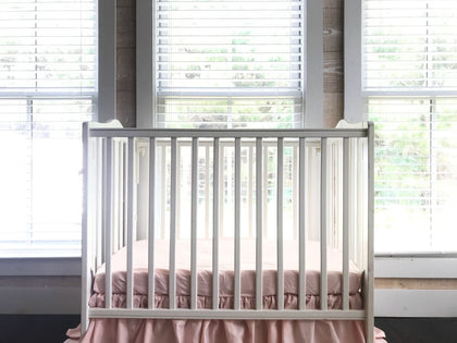 Ballet slipper pink fitted mini crib sheet, sized 24 by 38 inches