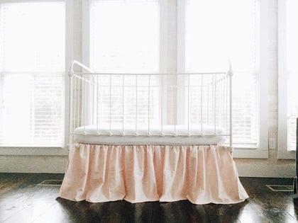 Ballet slipper pink farmhouse crib skirt with a 20-inch drop