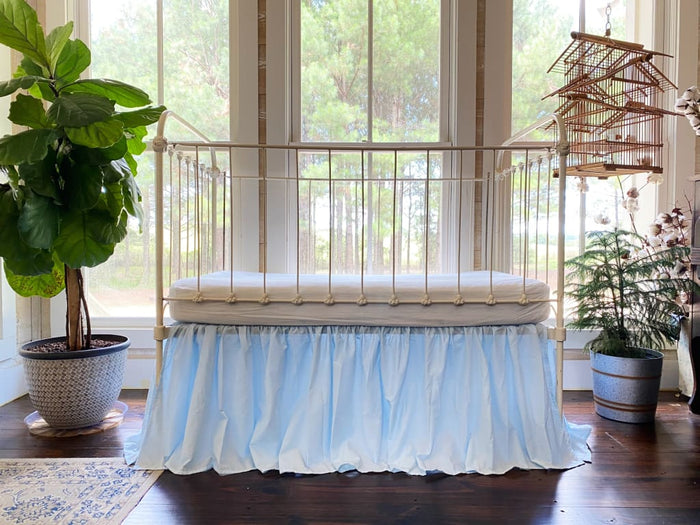 Heirloom blue farmhouse crib skirt in washed cotton, 20-inch drop with split corners