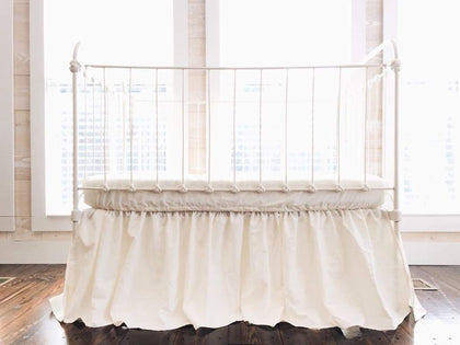 Ivory farmhouse crib skirt in washed cotton, 20-inch drop with split corners