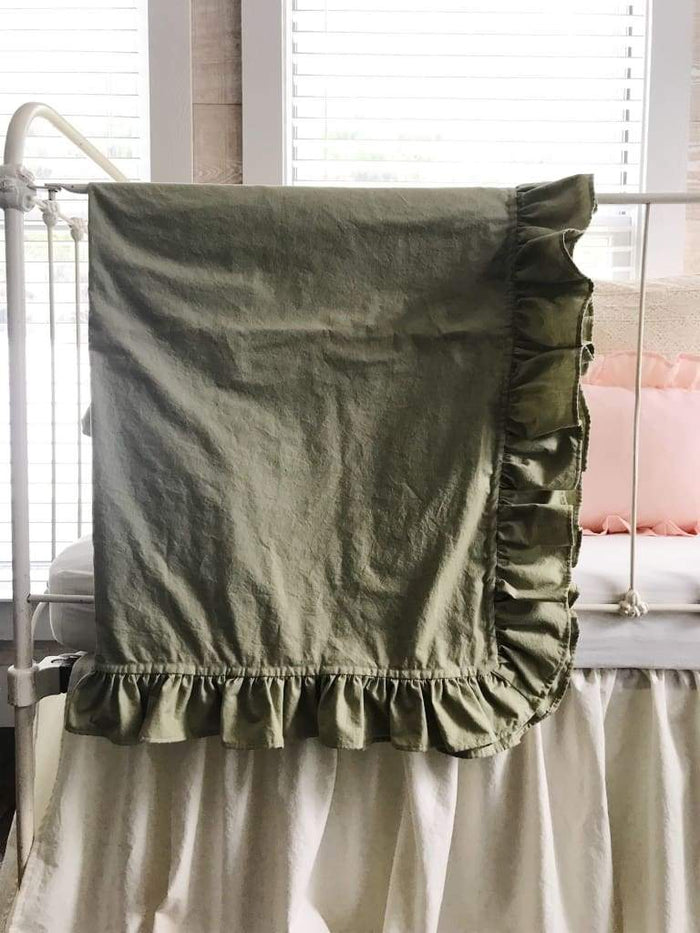 Sage green ruffled crib blanket in washed cotton, about 34 by 42 inches
