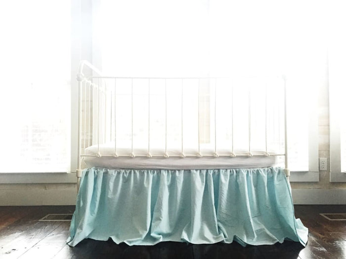 Seaglass farmhouse crib skirt in washed cotton, 20-inch drop with split corners
